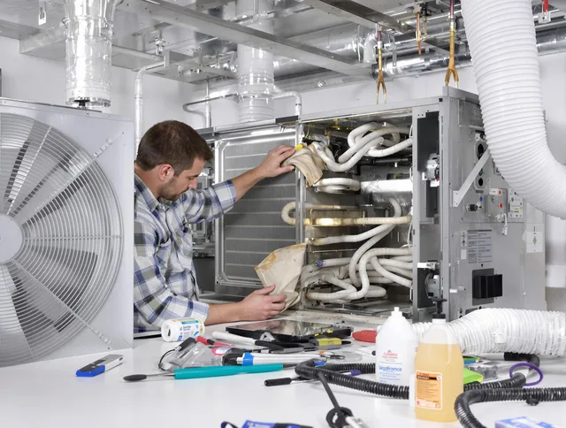 East Bridgewater Air Duct Cleaning specialist performing precision AC coil cleaning in East Bridgewater