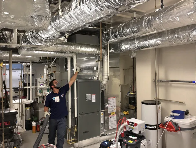 East Bridgewater Air Duct Cleaning specialist performing thorough furnace duct cleaning in a East Bridgewater residence