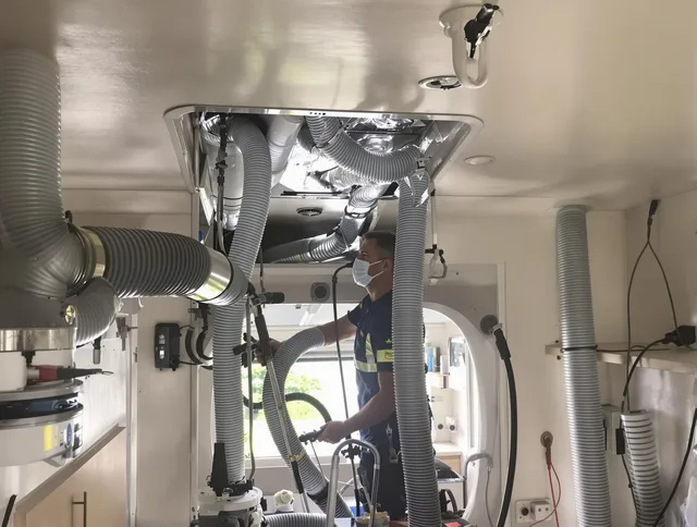 East Bridgewater Air Duct Cleaning specialist performing precise mobile home duct cleaning in East Bridgewater