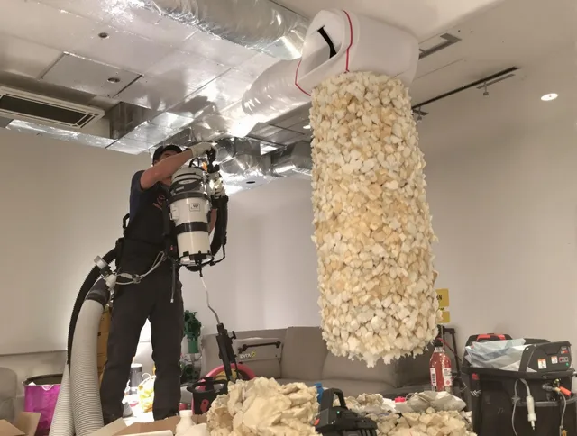 East Bridgewater Air Duct Cleaning technician performing precision vacuum insulation removal in a residential property in East Bridgewater