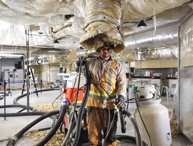 Professional vacuum insulation removal by East Bridgewater Air Duct Cleaning expert in East Bridgewater